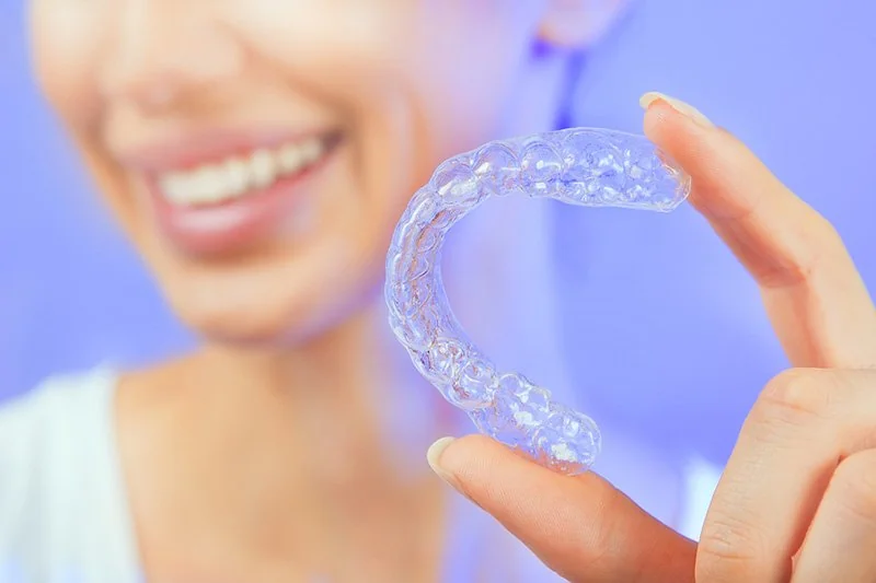 Smiling Girl with Tooth Tray